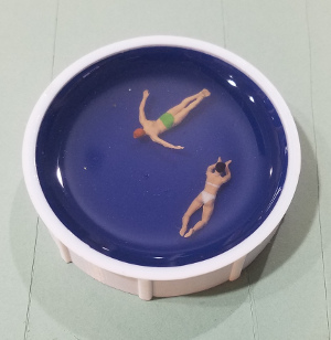 Man in Green, Lady in Lavender Pool - HO Scale image. See Text for Details.